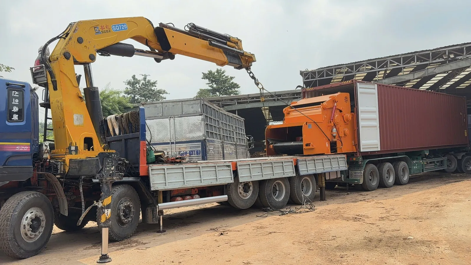 Wood crusher unloading from a truck at the Vietnam customer site